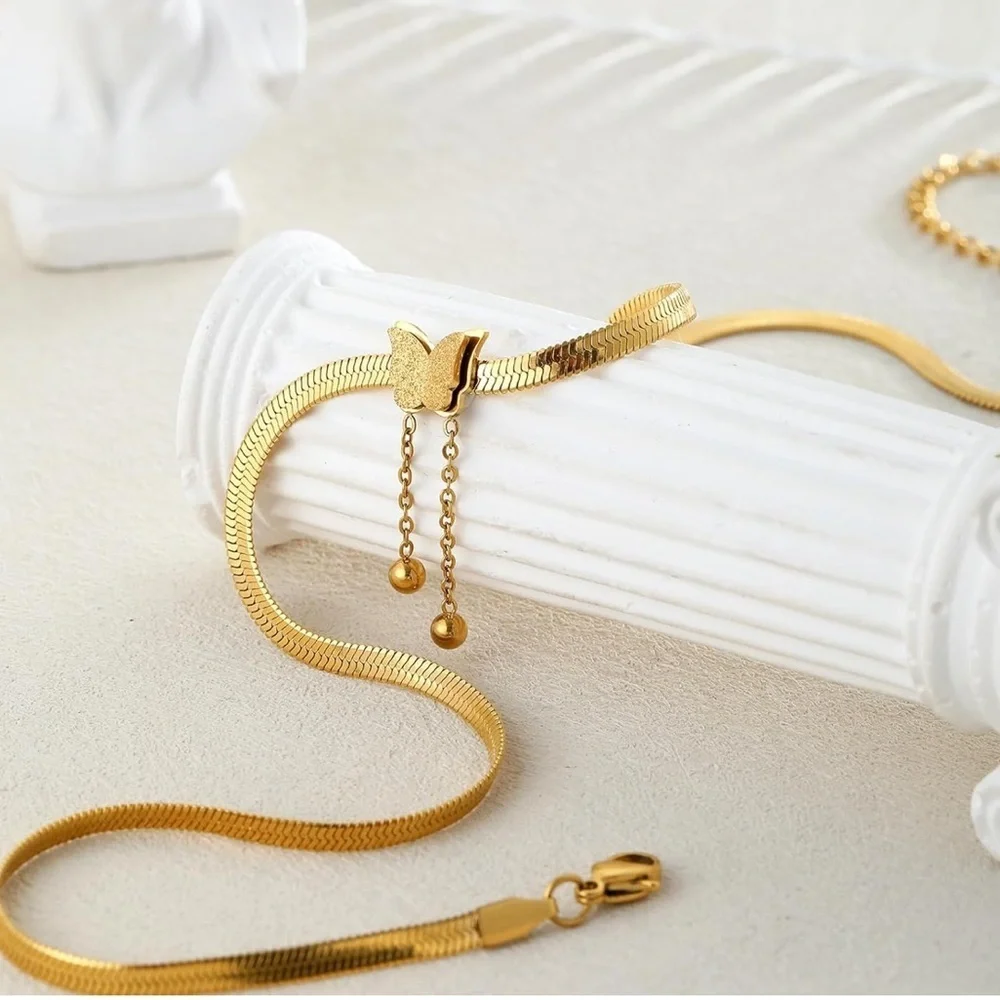 Herringbone style 14k plated gold necklace with butter slide pendant